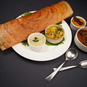 Food on Plate with Bowls of Sauces