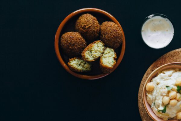 Overhead Shot of Fried Falafels Near a Hummus Dip